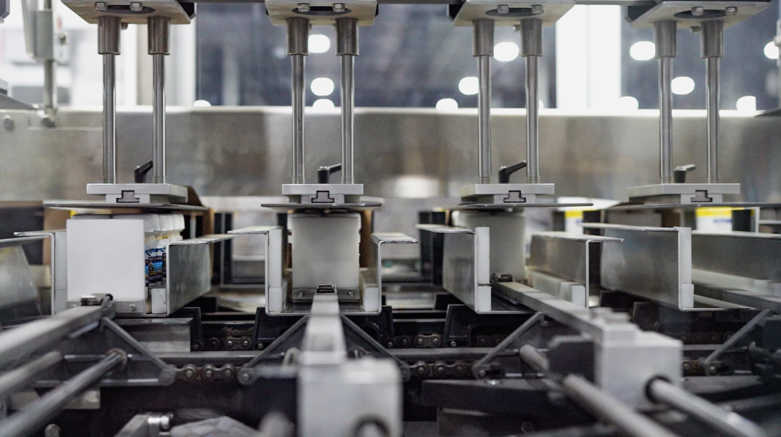 A close-up of an automated packaging machine running